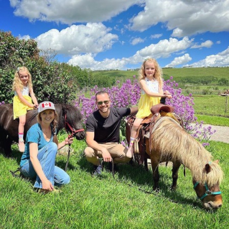 Amber Marshall and Shaun Turner with Ruby and Emanuella Spencer. 